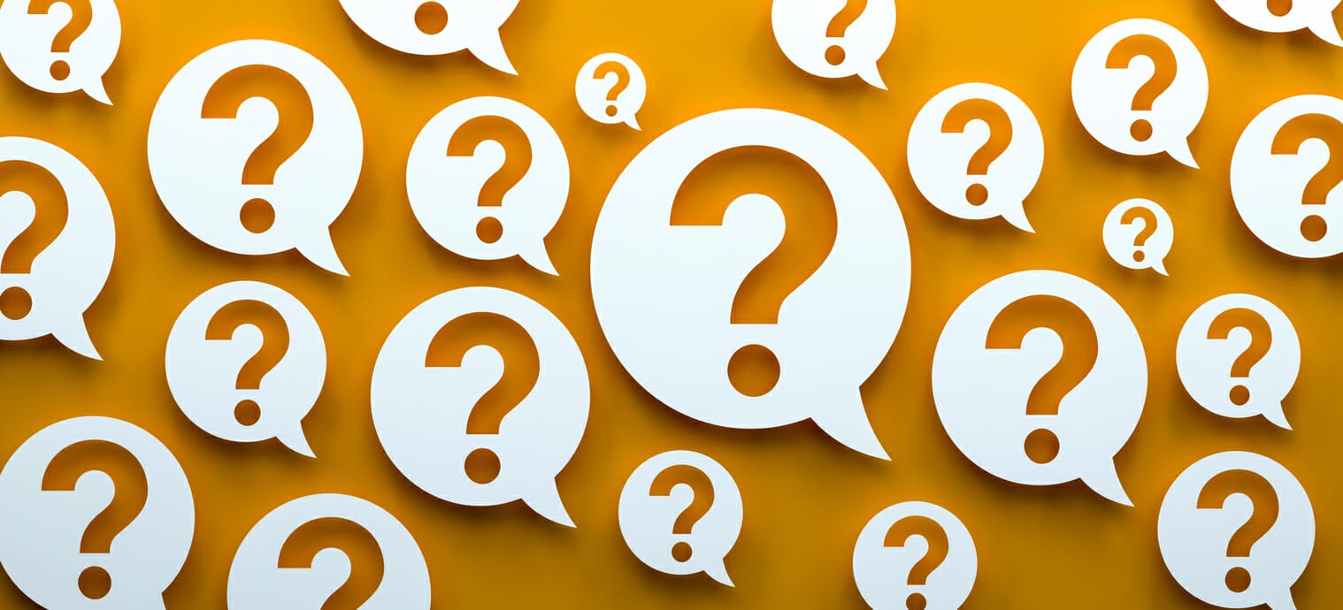 Multiple question marks inside speech bubbles on an orange background, symbolizing frequently asked questions about financial assistance for leukemia patients.