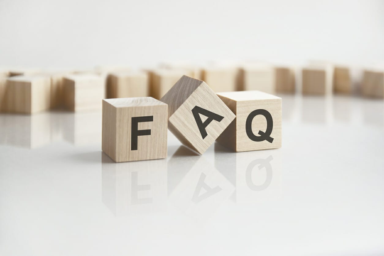 Wooden blocks spelling 'FAQ,' representing frequently asked questions about financial aid for Myelodysplastic Syndromes (MDS) patients.